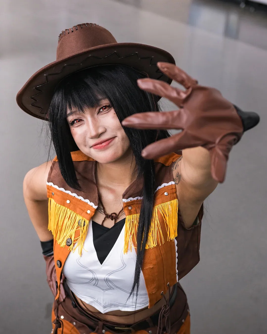 A cosplayer featuring Frieren from Frieren: Beyond Journey's End.