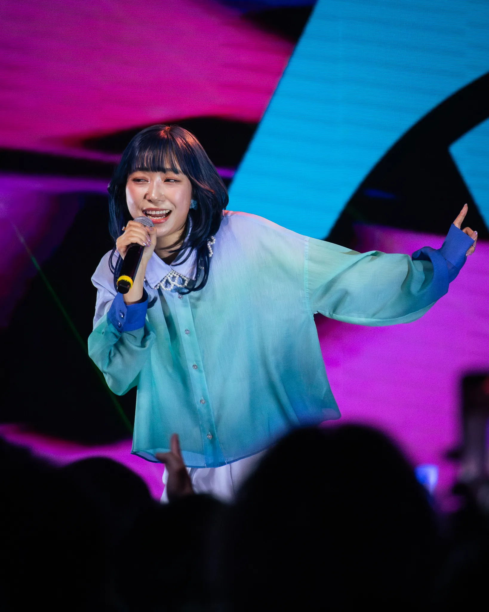 Aika Kobayashi, Japanese and voice actress performing on stage.