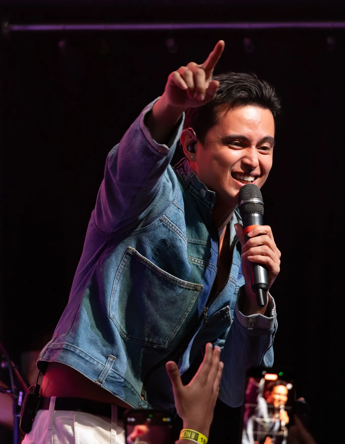 James Reid, an original filipino music artist who is performing on stage.