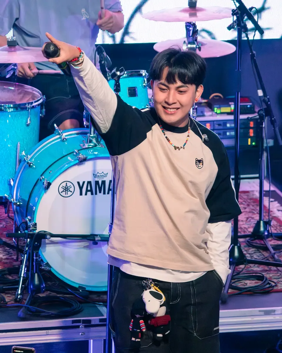 Maki, an original filipino music artist who is performing on stage.