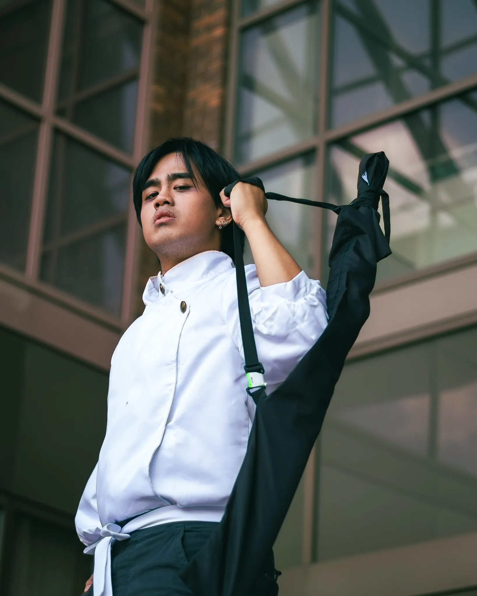 A cosplayer featuring Yuta from the anime series Jujutsu Kaisen.