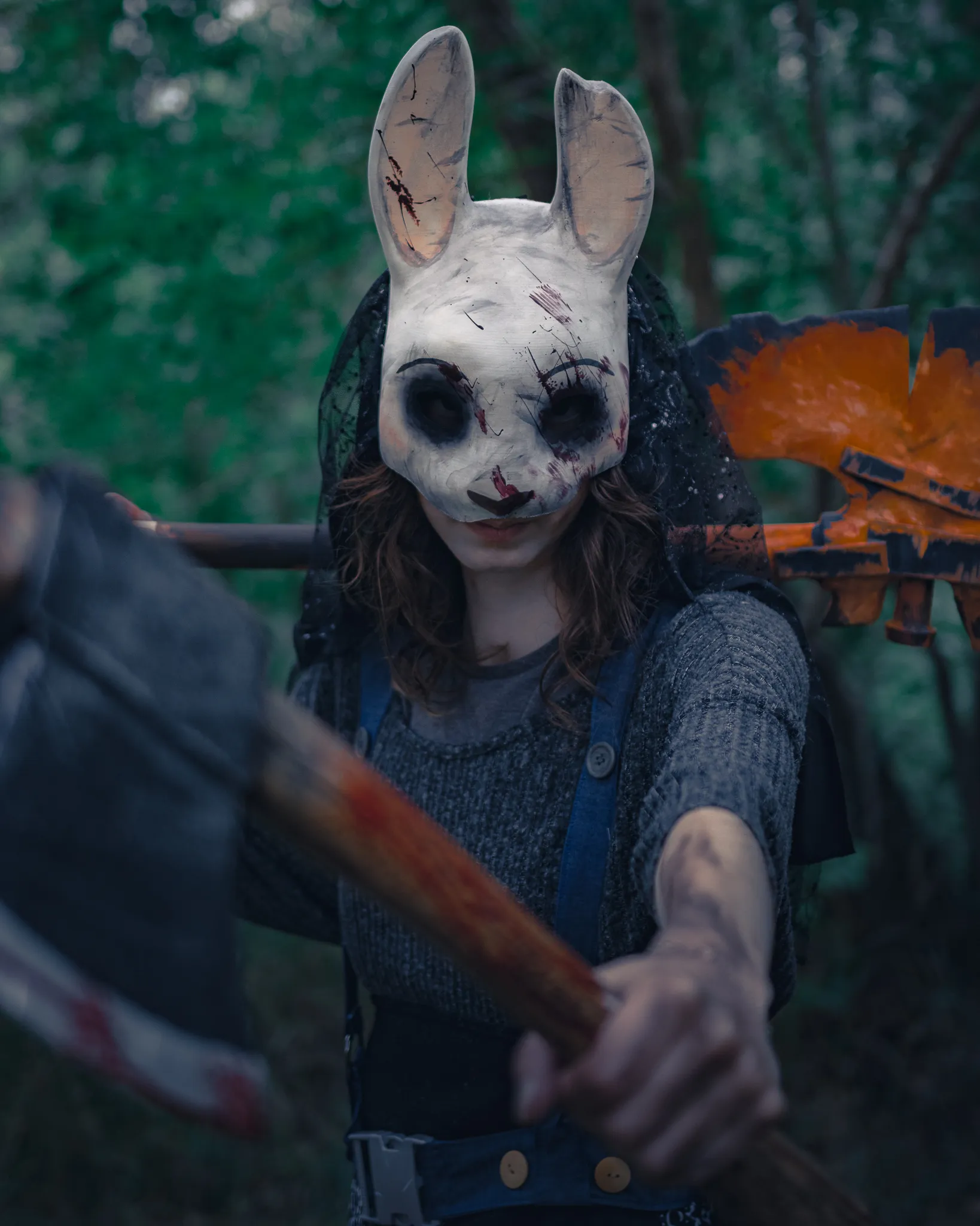 A cosplayer featuring Huntress from Dead By Daylight.